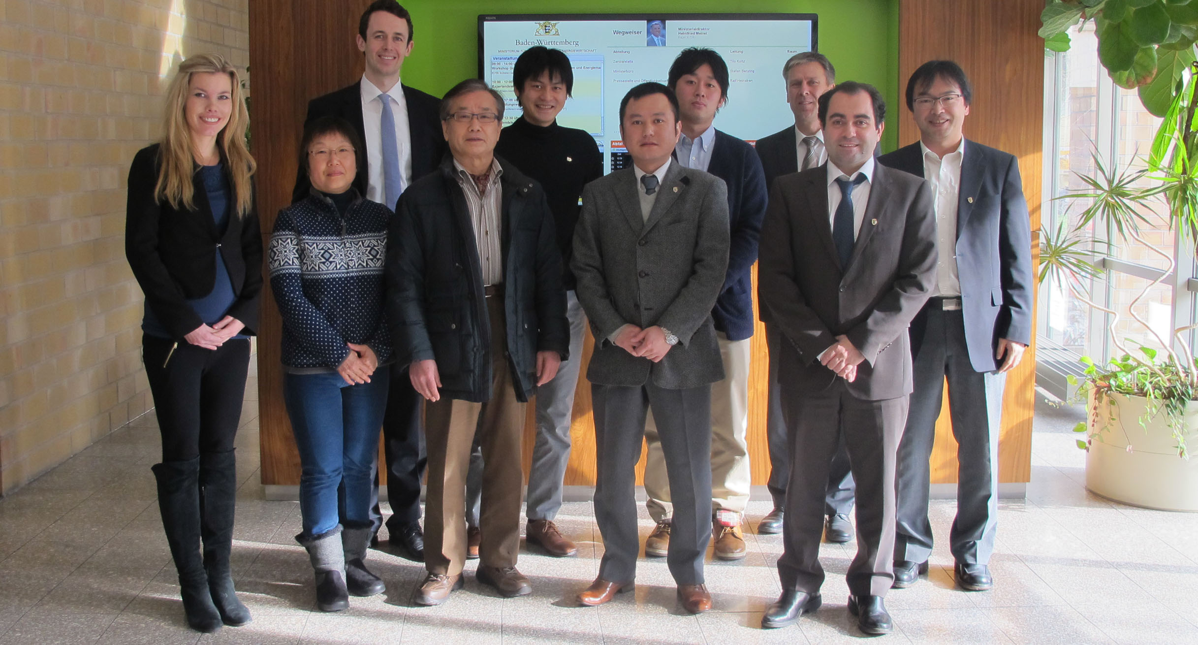Representatives from Kyoto University with members of staff from Ministry of the Environment.']